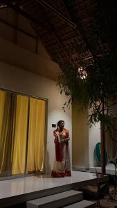a statue of a woman standing on a stage at Ananda Uthaan in Sreemangal
