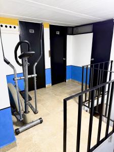 a room with a gym with a treadmill at Hotel Sol y Luna 2 in Medellín +1 photo