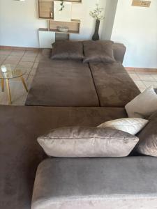 two beds with pillows on them in a room at Angolo del Tramonto in Gambarogno