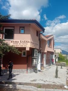 a man standing in front of a building at Къща Елена in Yagoda