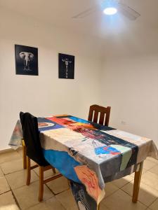 a table with a quilt on it in a room at Alojamiento En Resistencia Chaco in Resistencia +1 photo