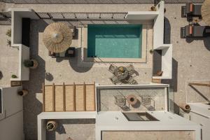 an aerial view of a house with a swimming pool at Abas Villas in Paránimfoi