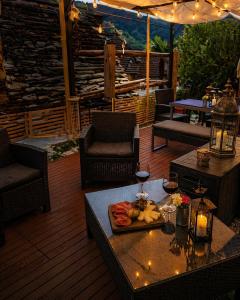 a patio with a table with a tray of fruit on it at B&B Osteria Morganti in Someo