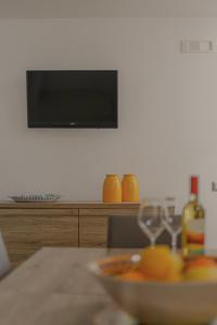 a bowl of food on a table with a television at La Primavera in Anacapri