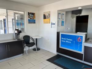 a waiting room with a large screen in a store at Motel 6-Visalia, CA in Visalia