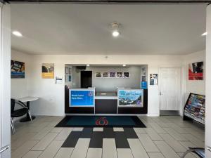 a room with two monitors on a tile floor at Motel 6-Visalia, CA in Visalia +34 photos