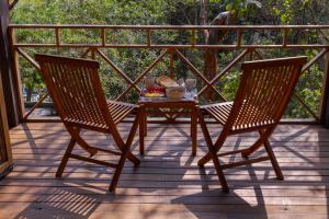 a table and two chairs on a porch at Hotel Boutique Siete Lunas in Sayulita +41 photos