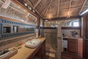 a bathroom with a sink and a shower at Hotel Boutique Siete Lunas in Sayulita