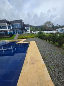 a swimming pool in front of a house at Finca Villa Sonada in Darién +12 photos