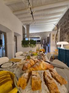 a table with a plate of food on top of it at PapalePapale B&B in Viterbo