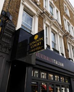 a sign for a london court hotel in front of a building at London Court Hotel in London +33 photos