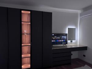 a room with a desk with a computer on it at Solemar4 in Vlorë