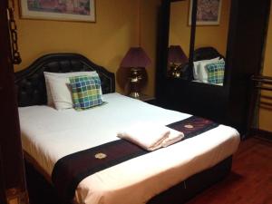 Cama o camas de una habitación en China Guest Inn