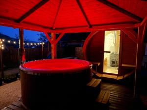 a red hot tub in a red tent at KLOBUCKÉ RETRO bydlení a wellness in Valašské Klobouky