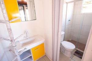 a bathroom with a sink and a toilet at Pousada bella mar buzios in Búzios +54 photos