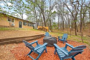 a group of blue chairs sitting in a yard at Radcliffe Ride Out Modern Bella Vista Retreat- Game Room, Fire Pit, Pet Friendly - Sleeps 10 in Bella Vista