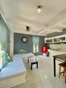 a living room with a couch and a table at Dajon#4-Barkada Generator & starlink in General Luna