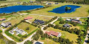 an aerial view of a house with a lake at VE040-Vejers-Strand-Jafdalvej-5 in Vejers Strand