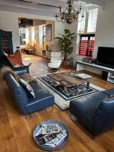 a living room with two couches and a table at Irene 2 in Hindeloopen