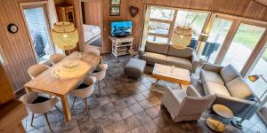 an aerial view of a living room with a table and chairs at VE125-Vejers-Strand-Aavej-19 in Vejers Strand