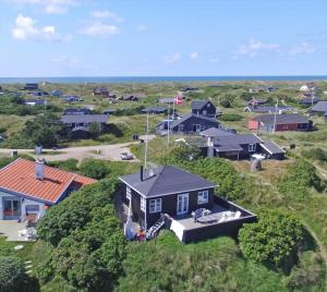 an aerial view of a small village with houses at VE147-Vejers-Strand-Violvej-16 in Vejers Strand