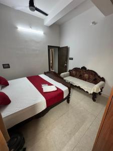 a bedroom with two beds and a mirror at Sofra service apartment by LUXE with swinging pool in Mysore
