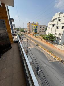 a view of a city street from a building at Sofra service apartment by LUXE with swinging pool in Mysore