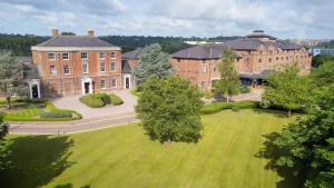 an aerial view of a large brick building with a park at DoubleTree by Hilton Stoke-on-Trent, United Kingdom in Stoke on Trent
