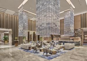 a rendering of the lobby of a hotel at Hilton Yancheng in Yancheng