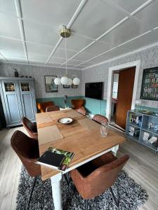 a dining room with a wooden table and chairs at AE325-Marstal-Skovgyden-32 in Marstal