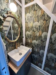 a bathroom with a sink and a mirror at AE325-Marstal-Skovgyden-32 in Marstal