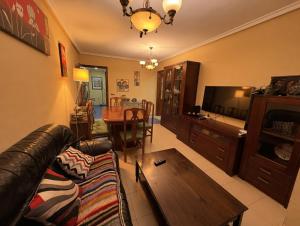 a living room with a couch and a table at Paseo del mar in Melilla