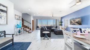 a living room with a couch and a table at Casa Bonita Encantame Estates in Playa Encanto