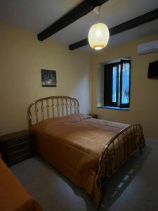 a bedroom with a large bed in a room at Domus Anemone B&B in Avellino