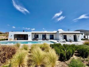 a house in the desert with a swimming pool at Faragas Hill Harmony Villa in Angairiá