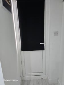 a door with a television on top of it at Best room in Birmingham