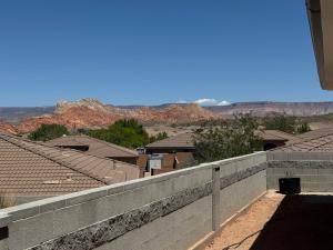 a view of a city from a retaining wall at New Casita by Zion National Park and Saint George in Hurricane