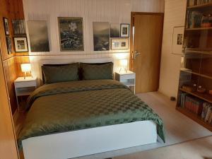 a bedroom with a large bed with two night stands at Hill Star in Mönchengladbach