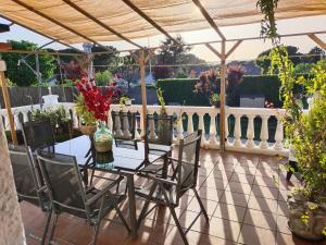 a patio with a table and chairs on a balcony at Montepino in Maello