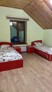 a room with two beds and a window at Villa Nabran in Nabran