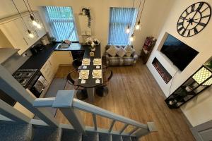 an aerial view of a kitchen and a living room at Snuggle Inn Burnley in Burnley