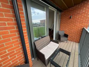 a porch with a bench on a balcony at Stunning 2Bedrooms, 2Baths, Balcony, Parking in Colindale