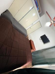 an overhead view of a bed in a room at Duplex parque in Santiago del Estero +7 photos