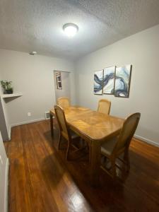 a dining room with a wooden table and chairs at The Hideaway in Cleveland