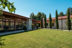 a large yard in front of a building at la Réserve by Duka Winery in Draç