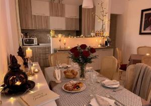 a dining room table with a vase of flowers on it at B&B Giulia in Taormina +58 photos