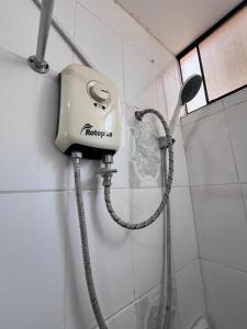 a shower in a bathroom with a shower at Minidpto Wayra Huanchaco in Huanchaco +9 photos