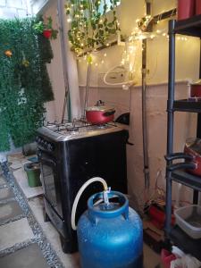 a kitchen with a stove with a pot on it at Boa Viagem Inn Pousada in Recife +59 photos