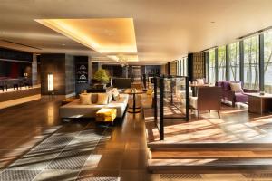 a lobby of a hotel with couches and chairs at DoubleTree by Hilton Kyoto Station in Kyoto