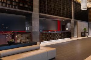 a lobby with a large screen in a building at DoubleTree by Hilton Kyoto Station in Kyoto